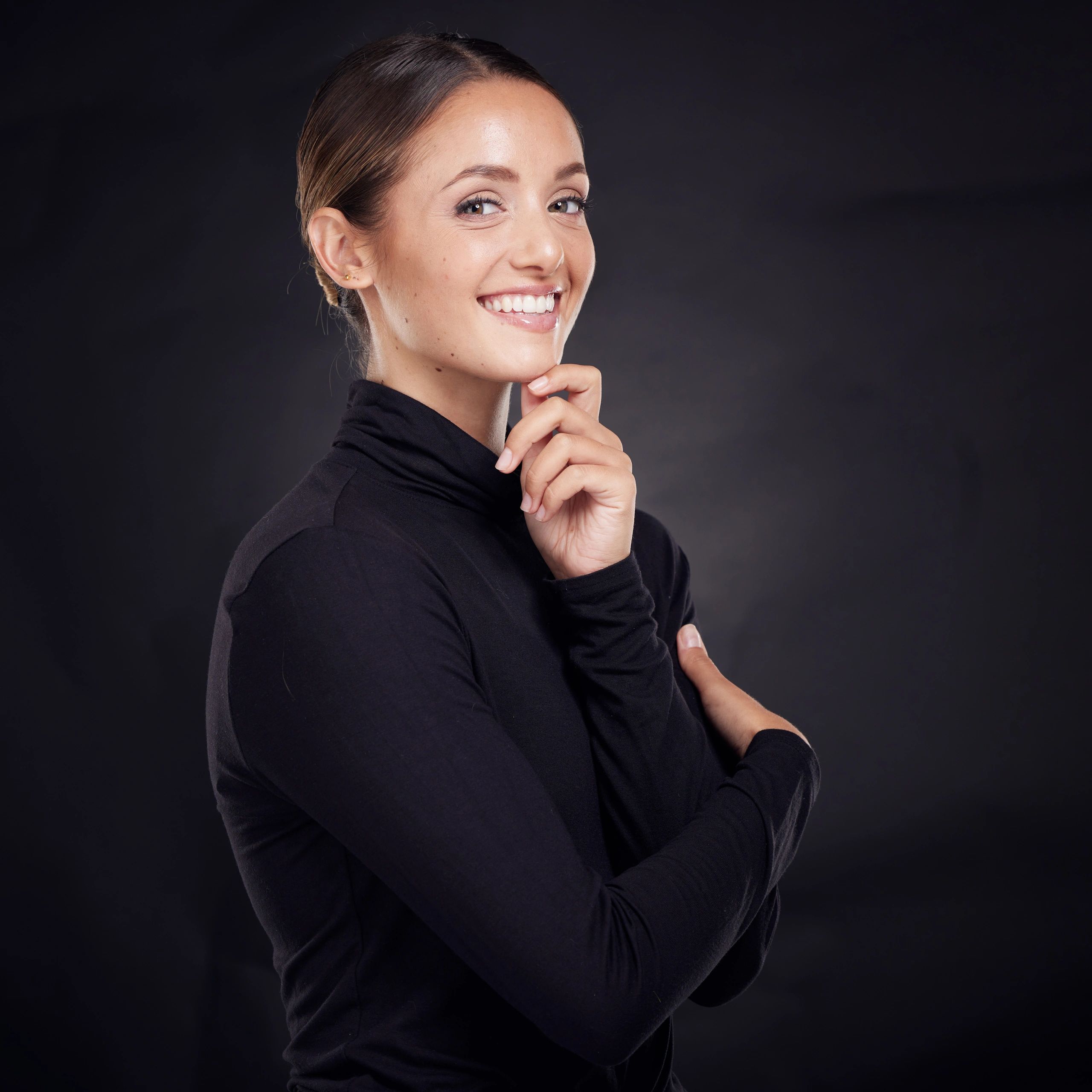 Portrait headshot of a coach on a dark background