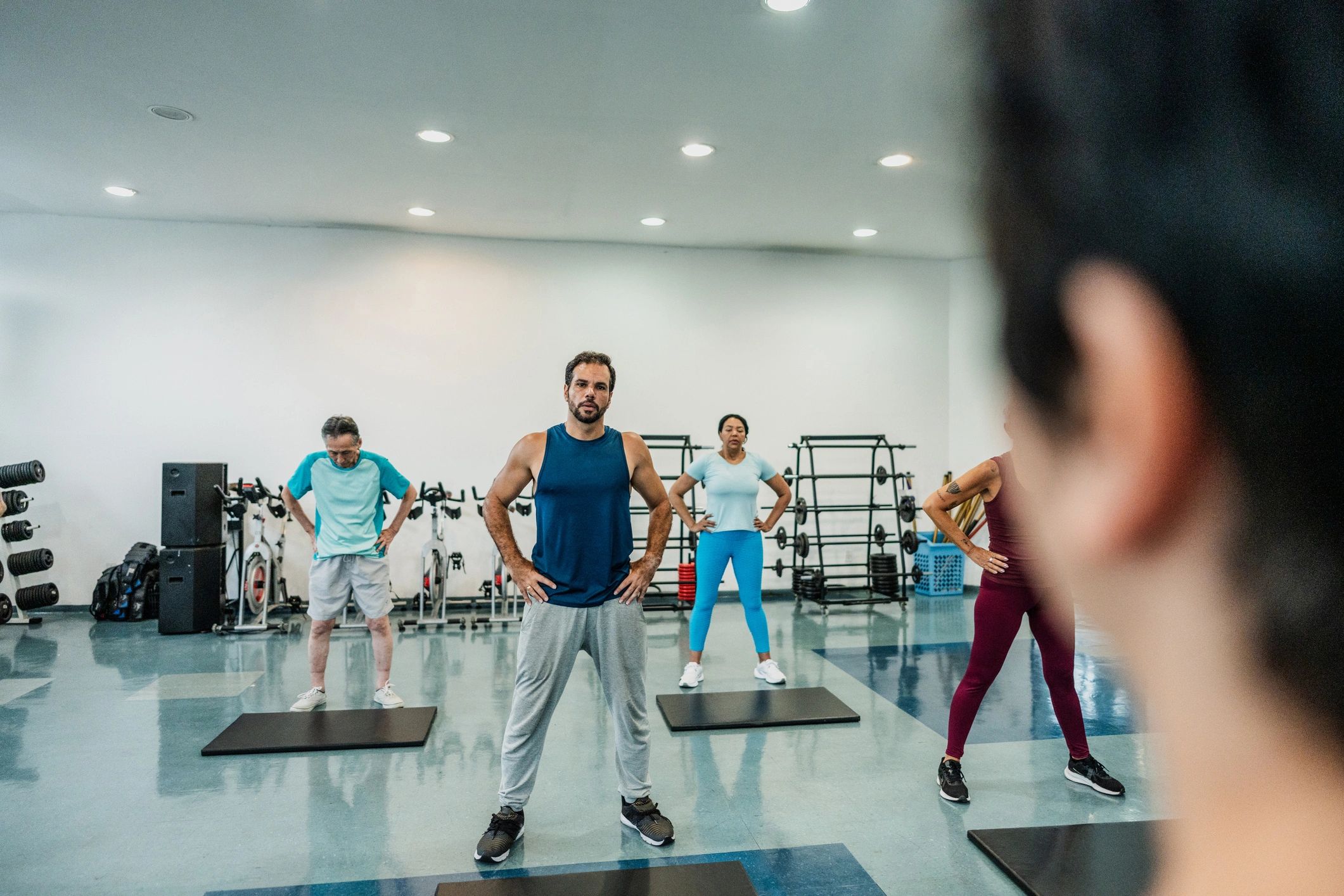 Group fitness class training together in a gym studio