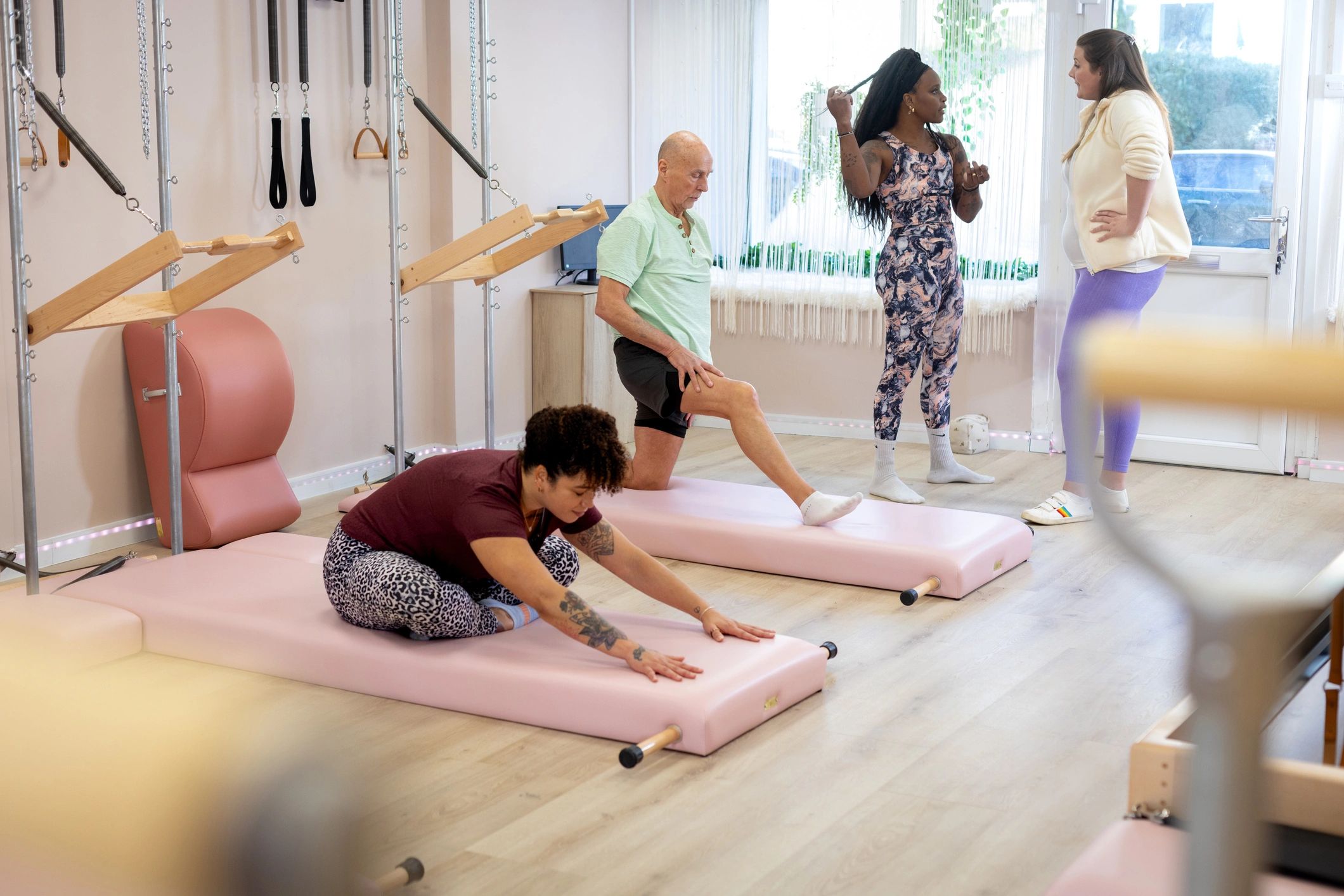 Group fitness class training together in a studio